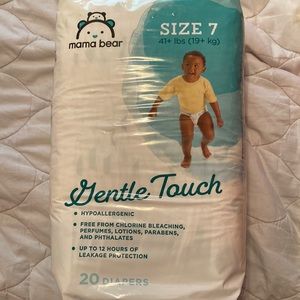 Four brand new packages of diapers. Never opened